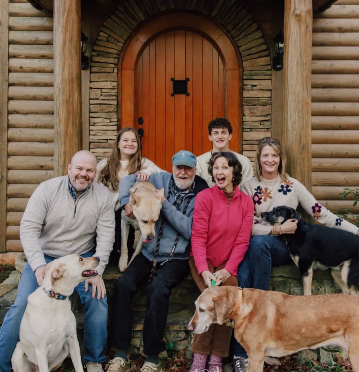 Spencer with his family and their dogs at home